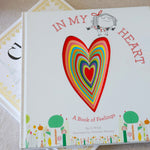 Book titled 'In My Heart' with a colorful heart illustration on a light surface.