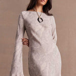 model wears a grey long sleeve dress