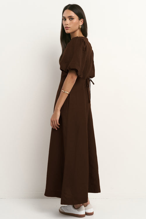 model wears a brown midi linen dress