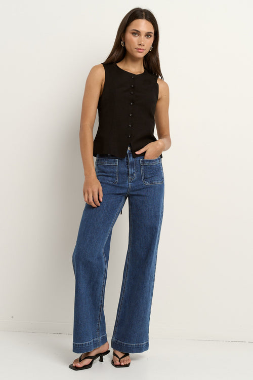 model wearing black linen vest