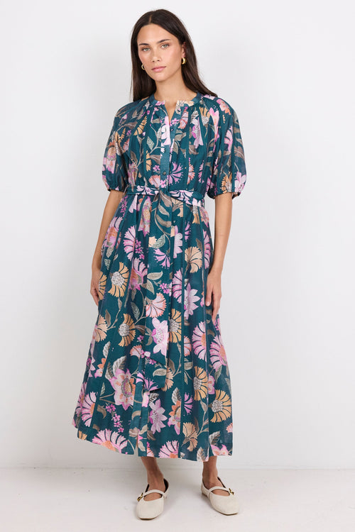 Woman wearing a floral dress on a white background