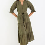 Woman wearing a green dress on a white background