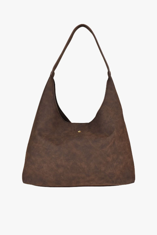 A chocolate brown suede shoulder bag
