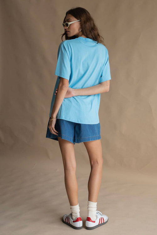 model wears a blue tee