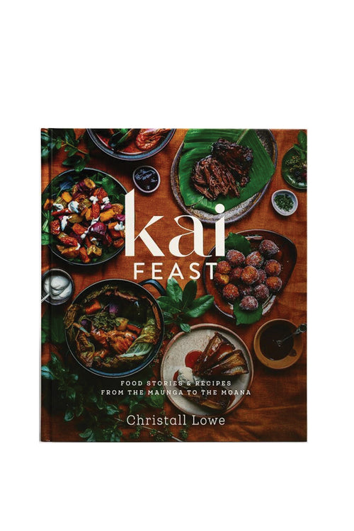 Book cover of 'kai FEAST' with images of food on a wooden table