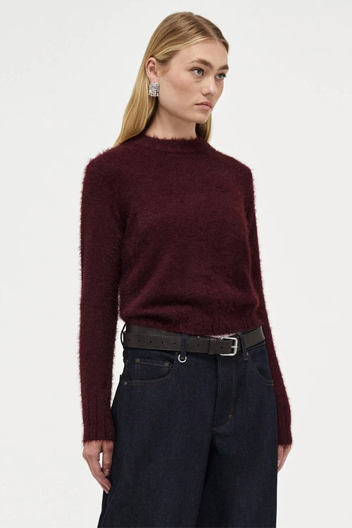 Model wears Burgundy long sleeve knit jumper