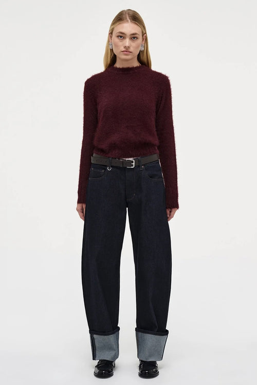 Model wears Burgundy long sleeve knit jumper