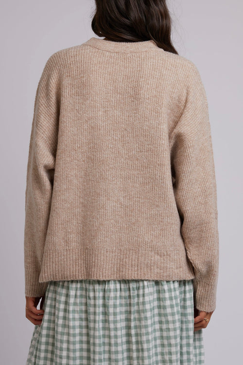 Model wearing beige knit.