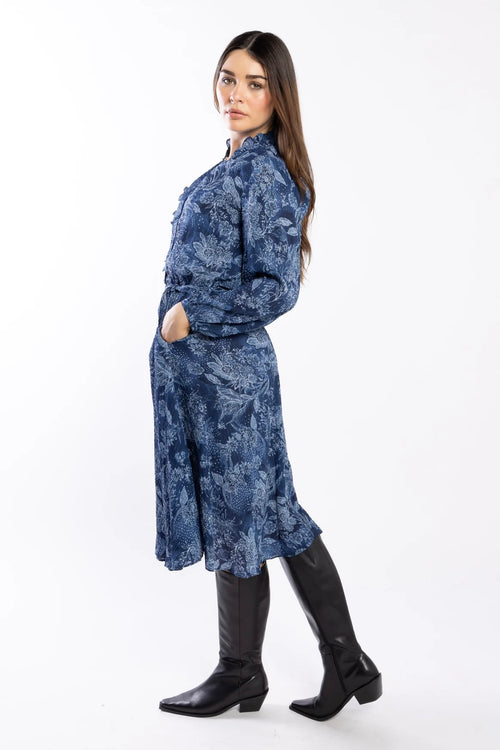 model wears a blue paisley pattern shirt style dress