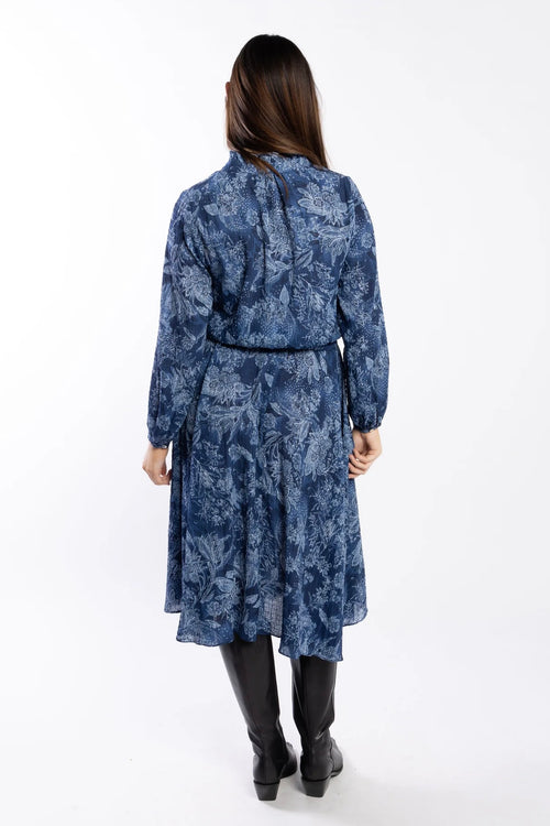 model wears a blue paisley pattern shirt style dress