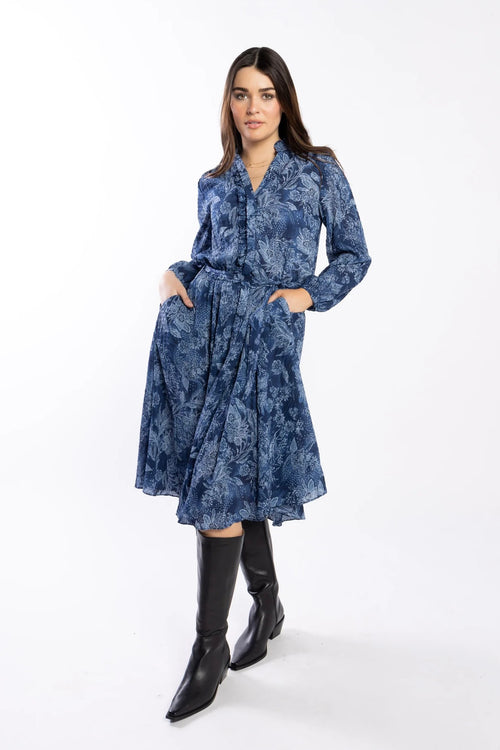 model wears a blue paisley pattern shirt style dress