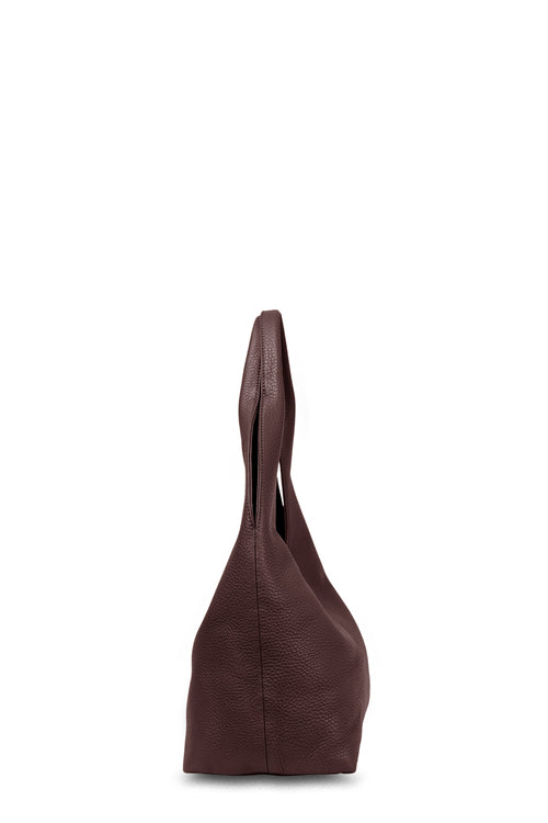 Brown leather handbag on a white background