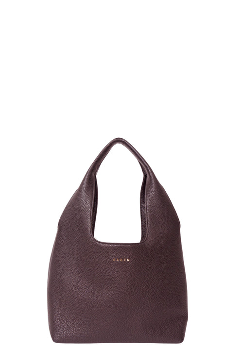 Brown handbag with 'SAGAN' branding on a white background