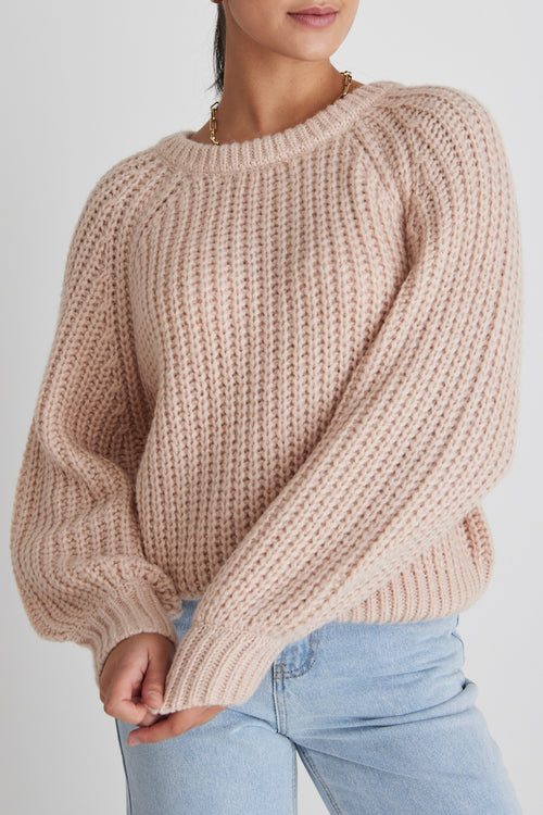 model wears a pink knit 