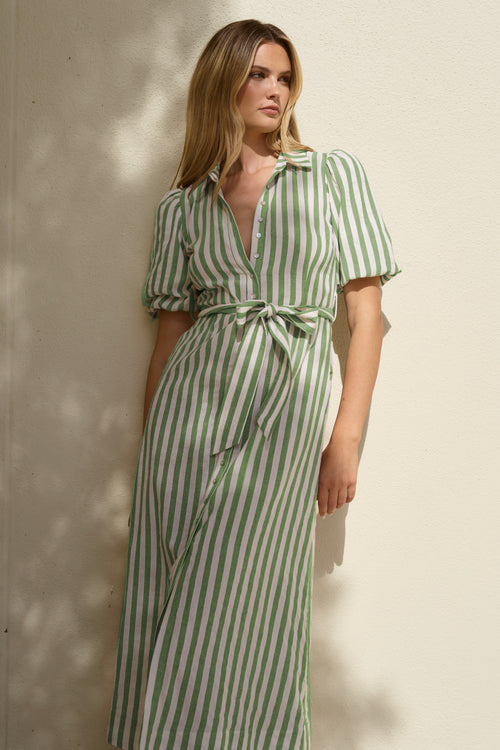 Woman wearing a moss and white striped short sleeve shirt dress with puff sleeves, button front, waist tie and collar