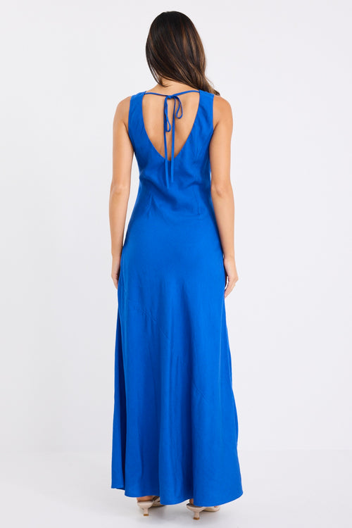 model wears a blue maxi dress