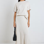 Model wears a beige linen maxi skirt