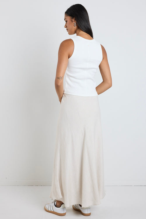 Model wears a beige linen maxi skirt