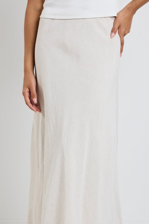 Model wears a beige linen maxi skirt