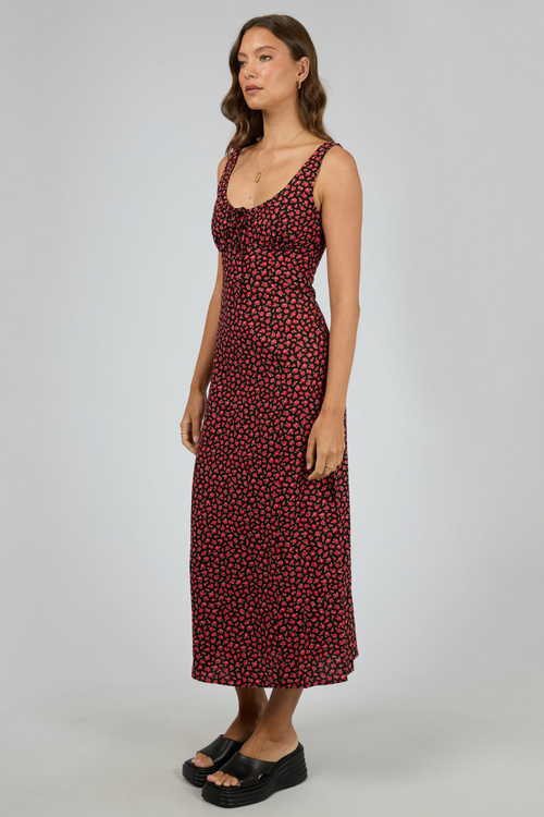 model wears red floral maxi dress