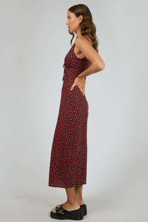 model wears red floral maxi dress