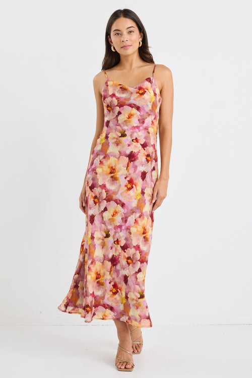 model wears a pink floral maxi dress
