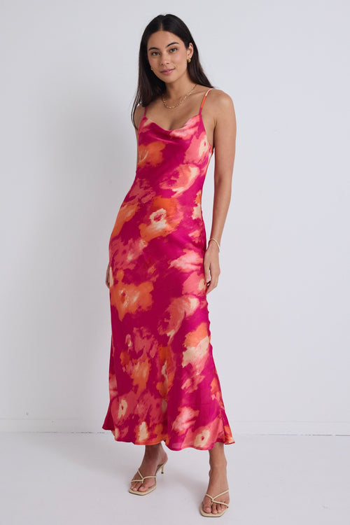 model wears a pink floral maxi dress