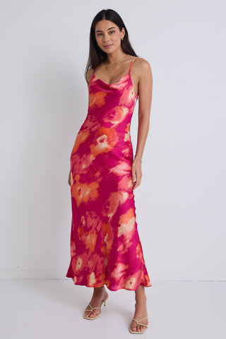 model wears a pink floral maxi dress