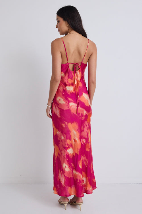 model wears a pink floral maxi dress