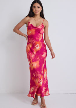 model wears a pink floral maxi dress