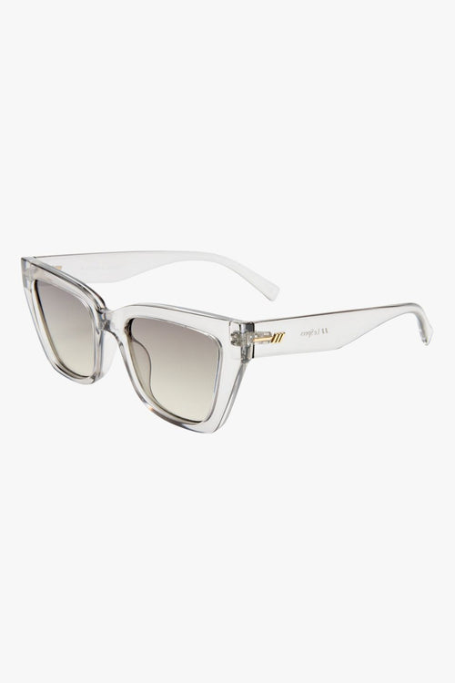 Transparent square cat-eye sunglasses with smoke gradient lenses.