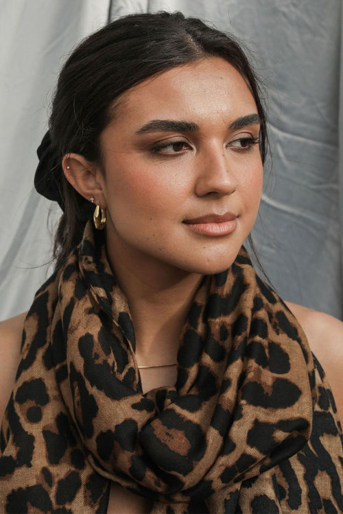 woman wearing leopard print scarf