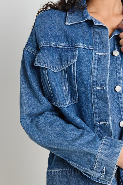 Model wears a blue denim jacket 