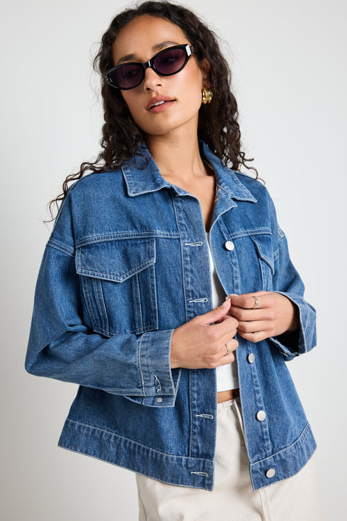 Model wears a blue denim jacket 