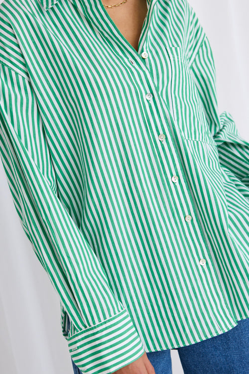 model wears a green stripe shirt