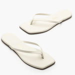 Pair of white flip-flops on a white background