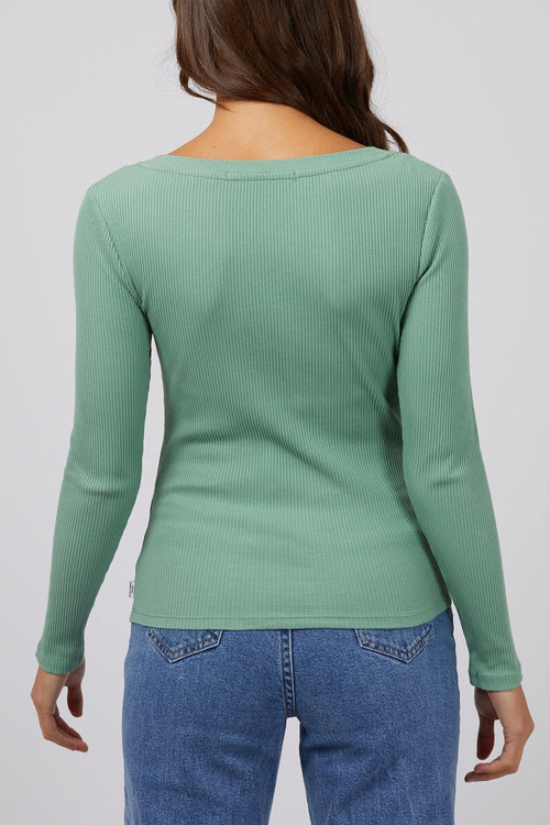 model wears a green rib long sleeve top