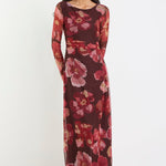 Woman wearing a floral dress on a white background