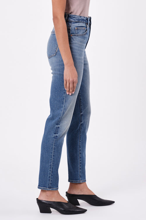model wears blue jean
