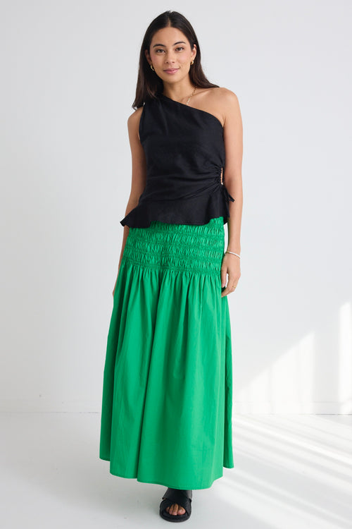 model wears a green poplin skirt