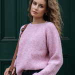 model wearing pink long sleeve wool knit jumper