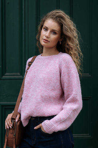 model wearing pink long sleeve wool knit jumper