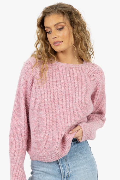 model wearing pink long sleeve wool knit jumper