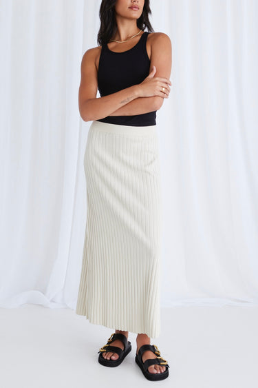 model wears a beige rib knit maxi skirt