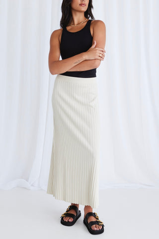 model wears a beige rib knit maxi skirt