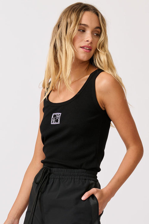 model wears a black logo tank