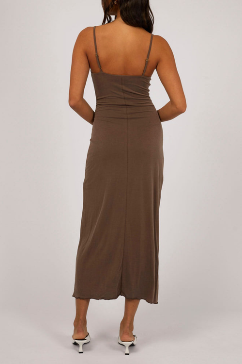 model wears brown maxi dress