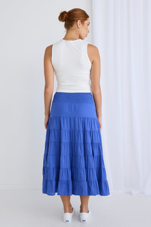 model wears a blue maxi skirt