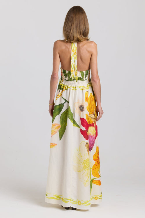 Woman wearing a floral dress with a white background