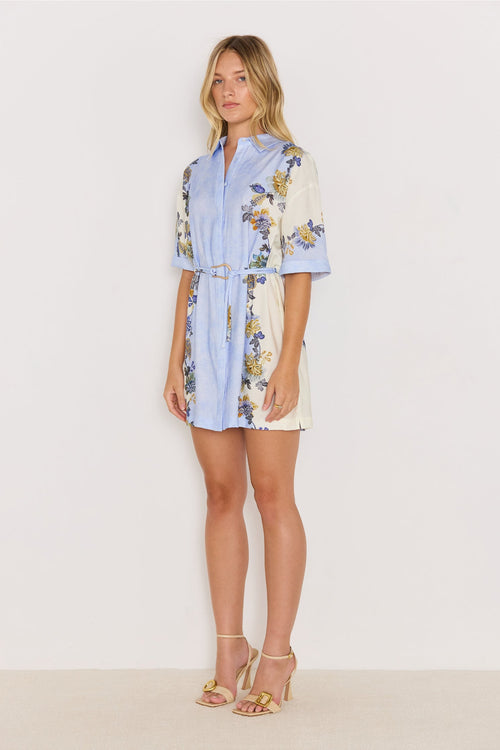 Woman wearing a floral dress with a white background